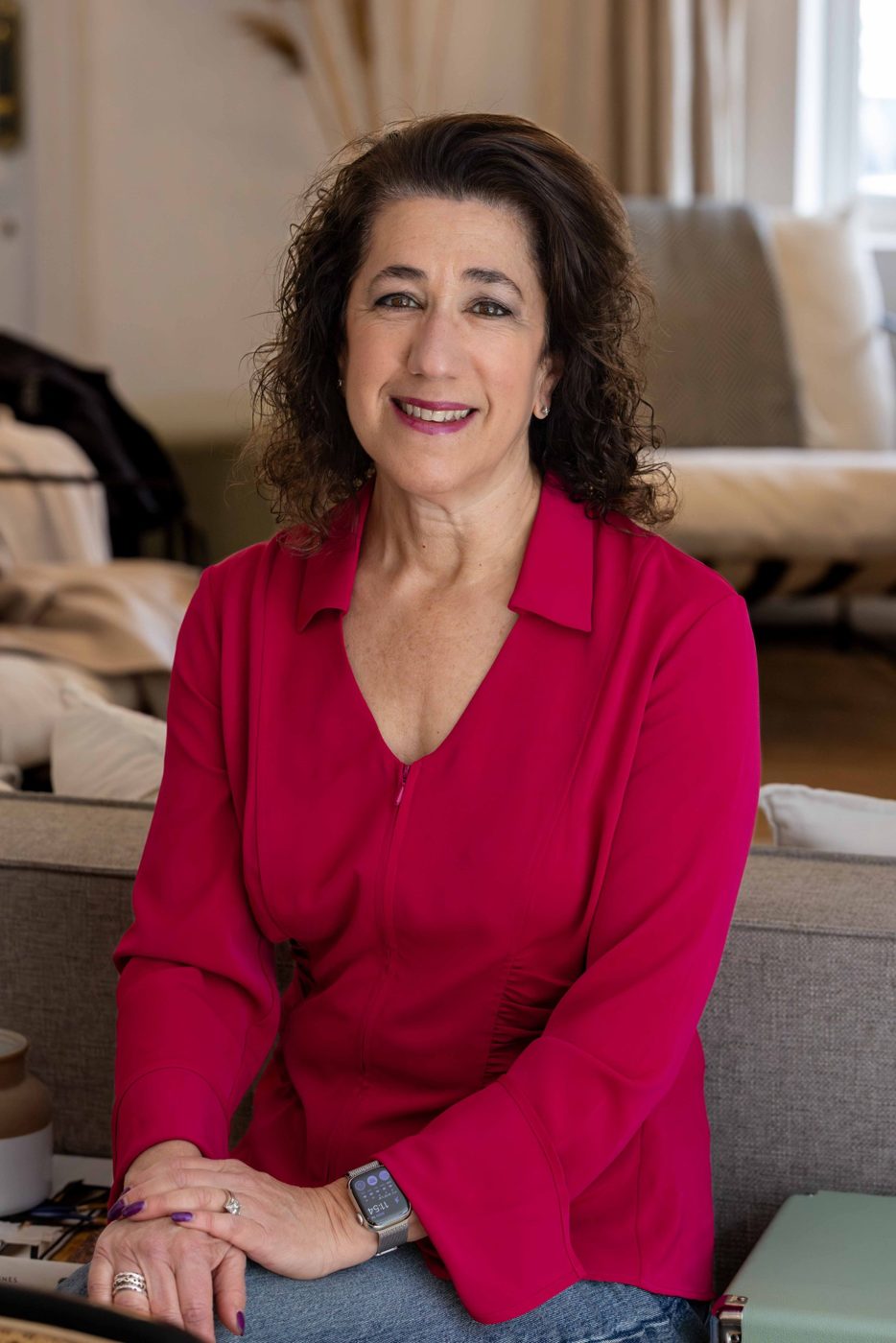 Portrait of Sara Curwen in a magenta blouse